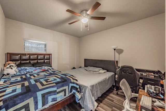 bedroom featuring hardwood / wood-style flooring and ceiling fan