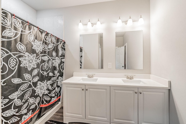 bathroom with a shower with curtain and vanity