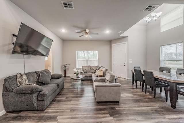 living room with dark hardwood / wood-style floors and ceiling fan