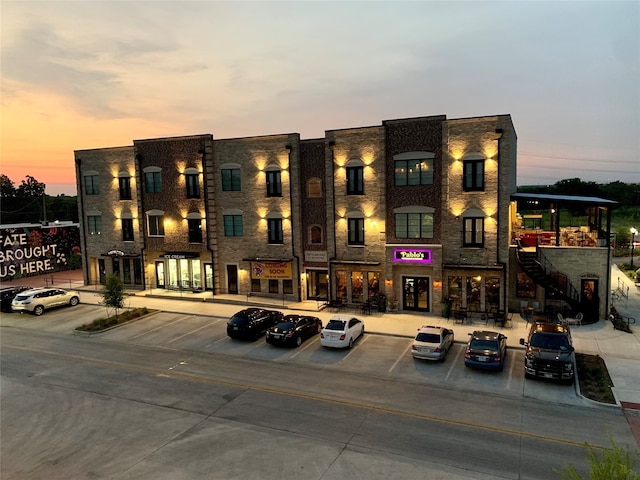 view of outdoor building at dusk