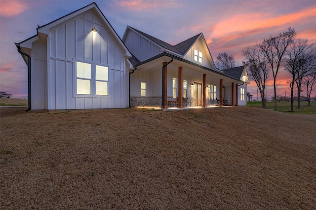 exterior space featuring a yard and a porch