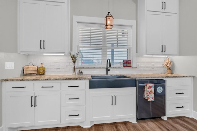 kitchen with white cabinetry, decorative light fixtures, dishwasher, and sink