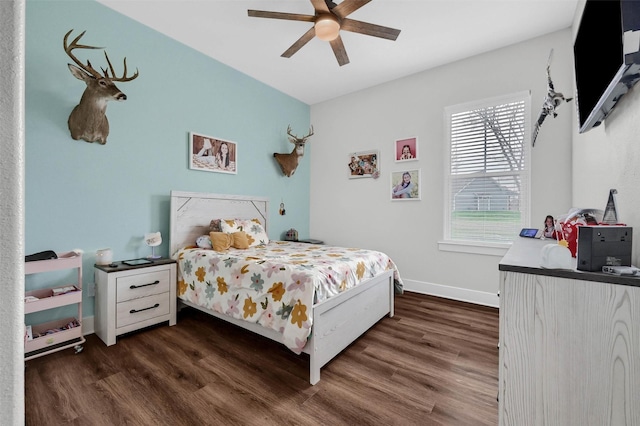 bedroom with dark hardwood / wood-style floors and ceiling fan