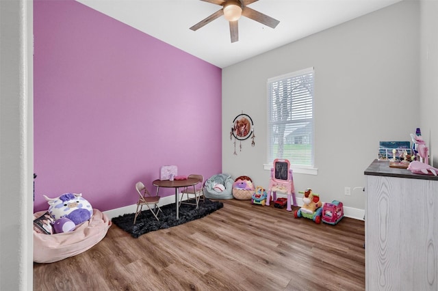 game room with hardwood / wood-style flooring and ceiling fan