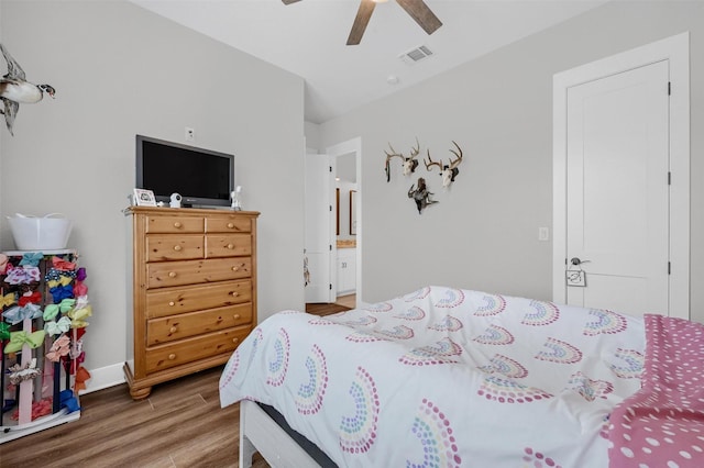 bedroom with wood-type flooring and ceiling fan