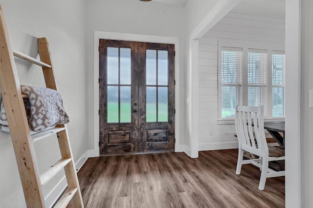 entrance foyer featuring french doors, wood-type flooring, and a wealth of natural light