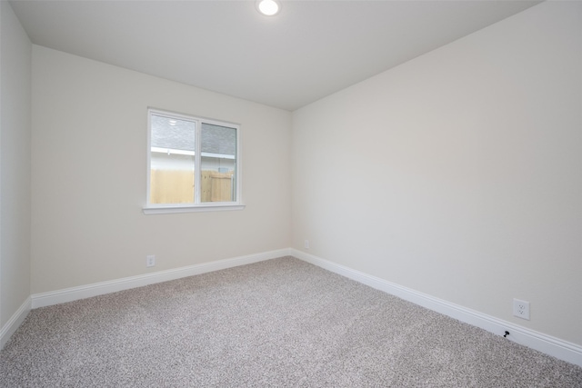 102 Walnut St, Whitesboro, TX 76273 - spare room featuring carpet floors, baseboards, and recessed lighting
