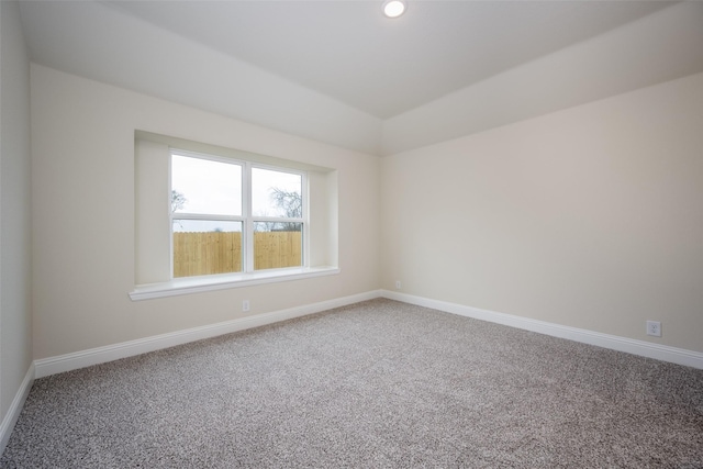 102 Walnut St, Whitesboro, TX 76273 - carpeted empty room featuring baseboards, lofted ceiling, and recessed lighting