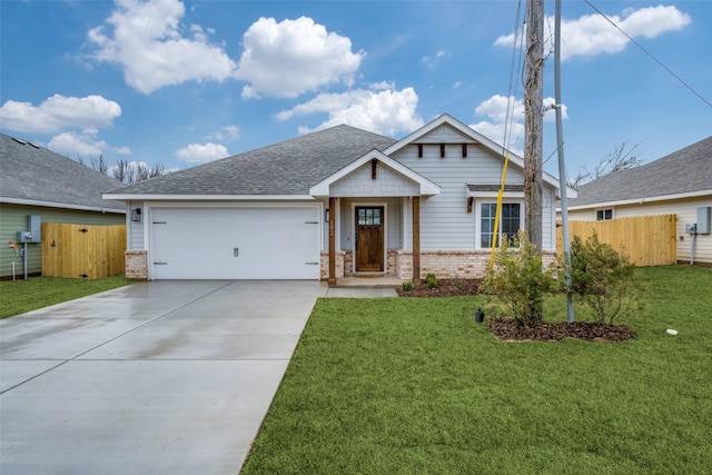 craftsman house with an attached garage, driveway, brick siding, and fence