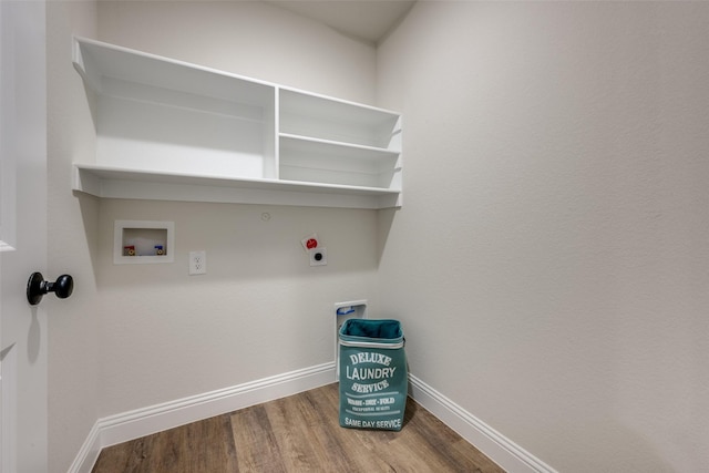 laundry area with hardwood / wood-style floors, washer hookup, hookup for an electric dryer, and hookup for a gas dryer