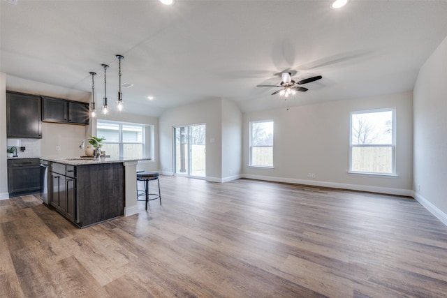 102 Walnut St, Whitesboro, TX 76273 - kitchen with a sink, a ceiling fan, open floor plan, recessed lighting, and an island with sink
