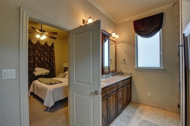 bathroom featuring ornamental molding, vanity, and ceiling fan