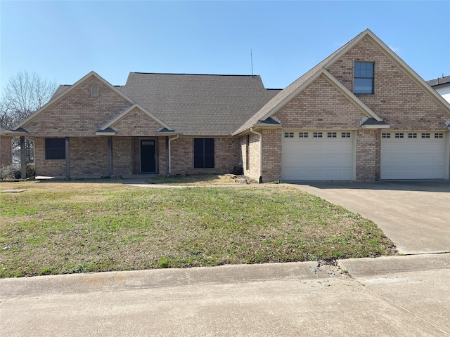 view of front facade featuring a garage and a front lawn