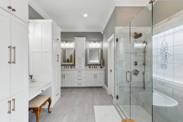 bathroom with vanity, crown molding, plenty of natural light, and plus walk in shower