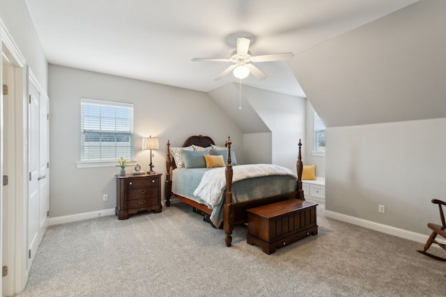 carpeted bedroom featuring lofted ceiling and ceiling fan