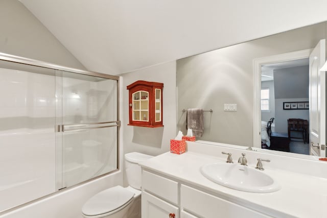 full bathroom featuring enclosed tub / shower combo, vanity, lofted ceiling, and toilet