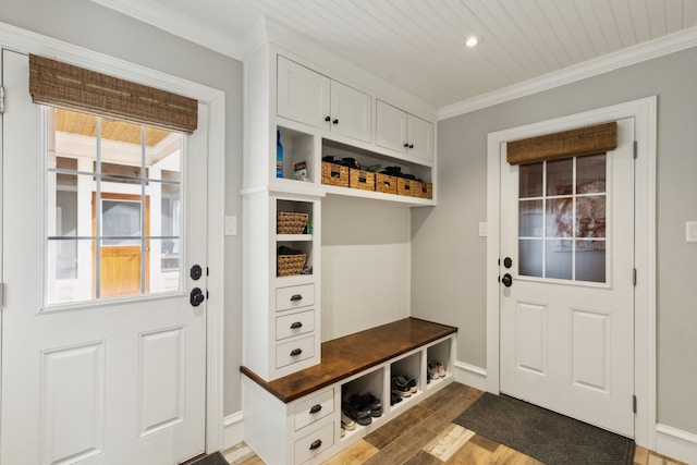 mudroom featuring crown molding, dark wood-type flooring, and wooden ceiling