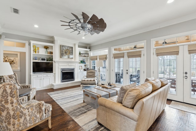 living room featuring french doors, ceiling fan, crown molding, and hardwood / wood-style floors