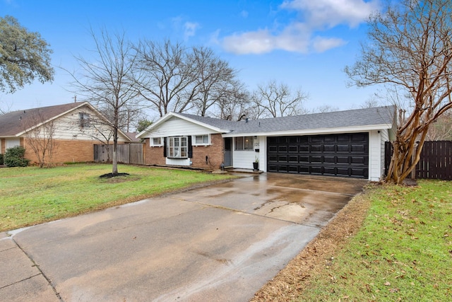 ranch-style home with a garage and a front lawn