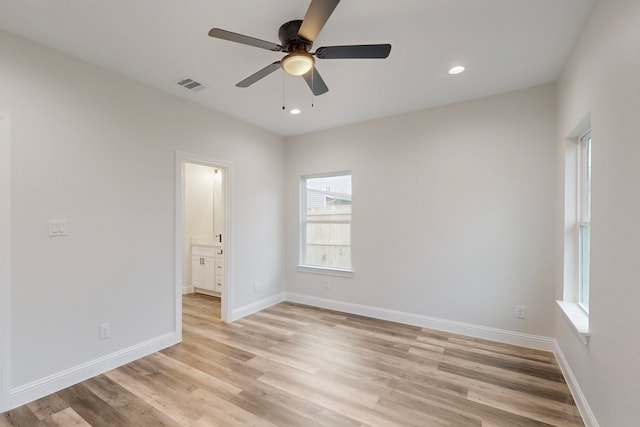 unfurnished room featuring ceiling fan and light wood-type flooring