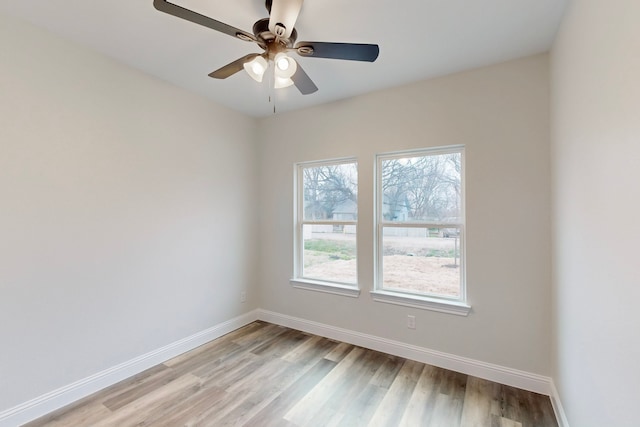 spare room with ceiling fan and light hardwood / wood-style flooring