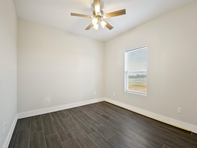 unfurnished room with dark hardwood / wood-style flooring and ceiling fan