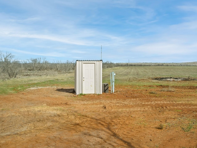 view of outdoor structure featuring a rural view