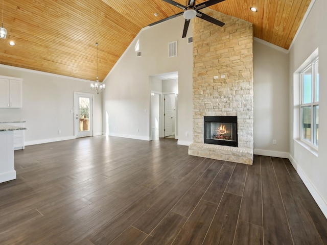 unfurnished living room featuring wood ceiling, high vaulted ceiling, dark hardwood / wood-style floors, a fireplace, and ceiling fan with notable chandelier