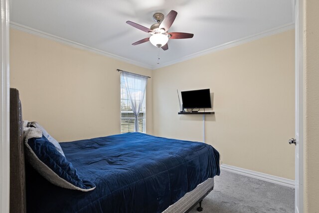 bedroom featuring crown molding, carpet floors, and ceiling fan