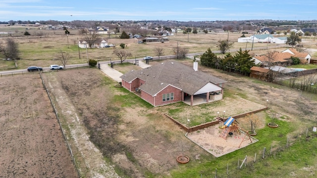 birds eye view of property featuring a rural view
