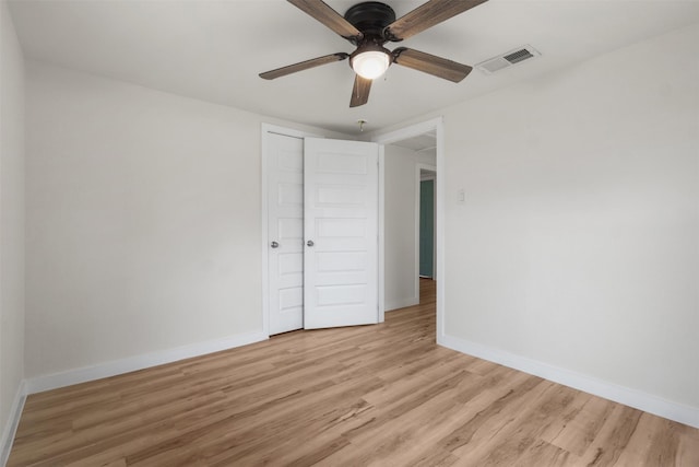 spare room with ceiling fan and light hardwood / wood-style floors