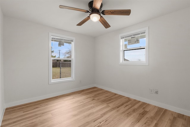 spare room featuring ceiling fan and light wood-type flooring