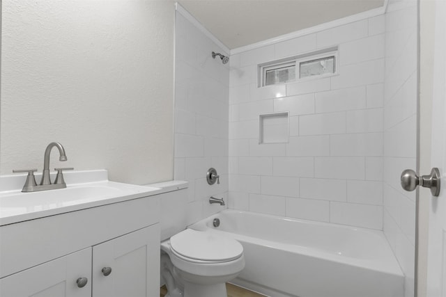 full bathroom featuring vanity, toilet, and tiled shower / bath combo