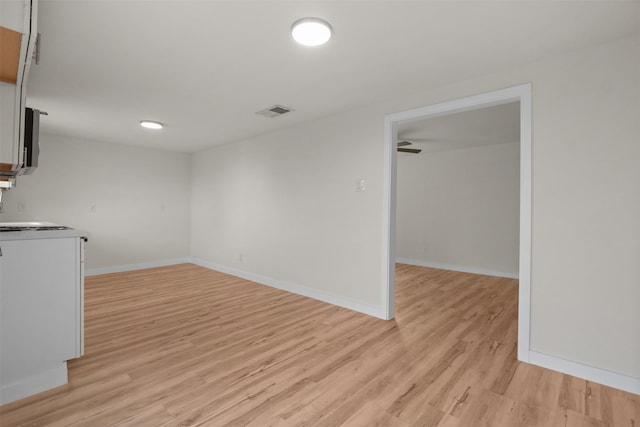 spare room with light hardwood / wood-style flooring