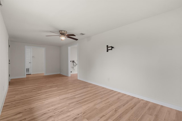 spare room featuring ceiling fan and light wood-type flooring