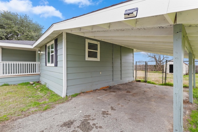 view of side of property featuring a carport