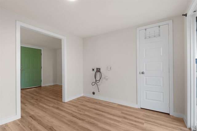 washroom with gas dryer hookup, electric dryer hookup, washer hookup, and light wood-type flooring