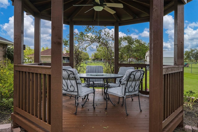 wooden deck featuring a gazebo and ceiling fan