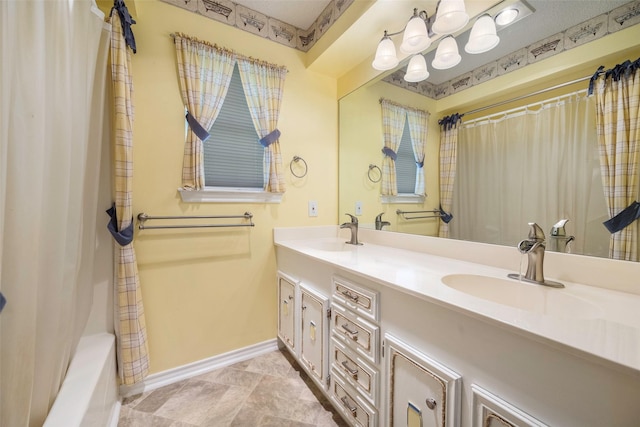 bathroom featuring vanity and shower / bath combo with shower curtain