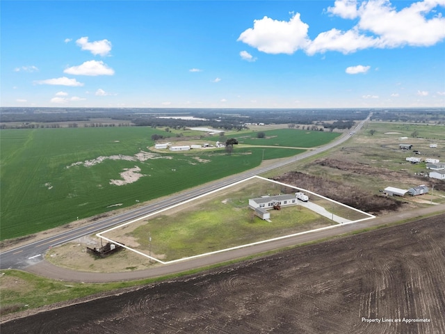 birds eye view of property featuring a rural view