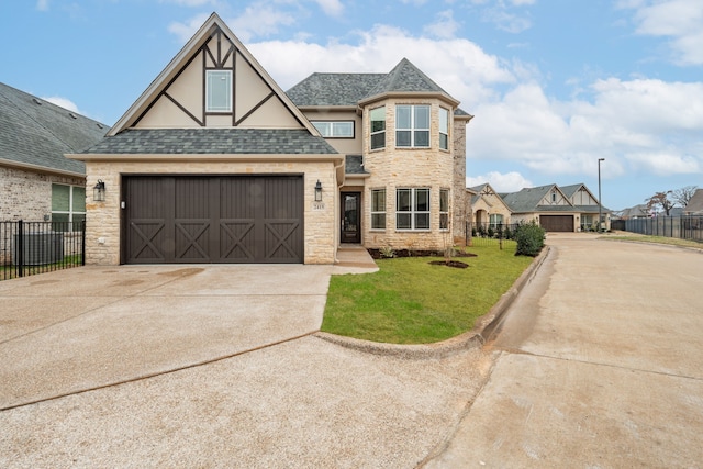 view of front facade featuring a garage and a front lawn