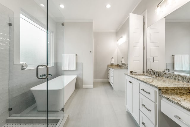 bathroom featuring vanity, crown molding, and shower with separate bathtub