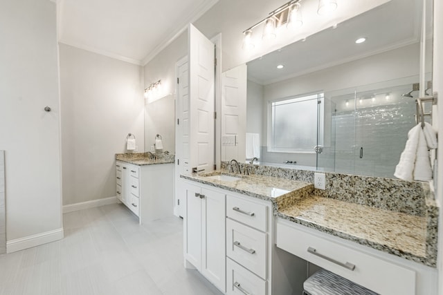 bathroom featuring ornamental molding, a shower with shower door, and vanity