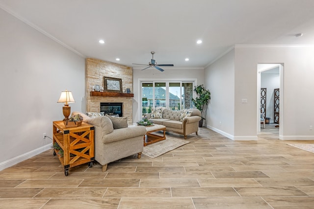 living room with ceiling fan, ornamental molding, and a fireplace