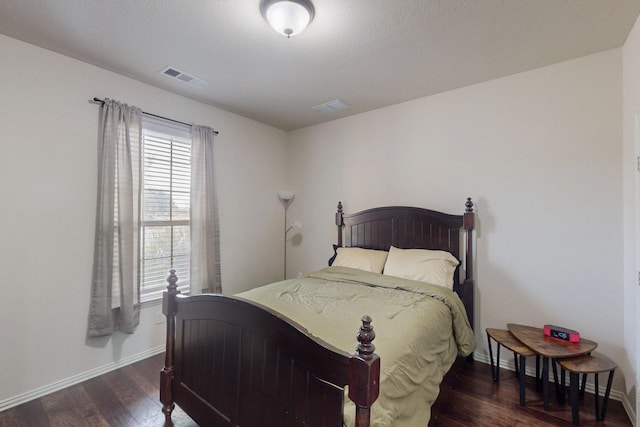 bedroom featuring dark wood-type flooring