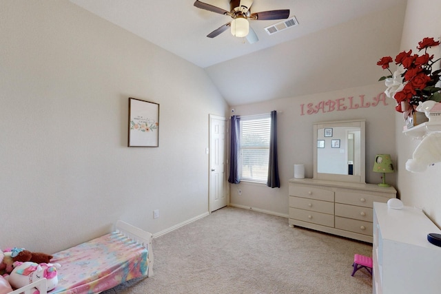 carpeted bedroom with vaulted ceiling and ceiling fan