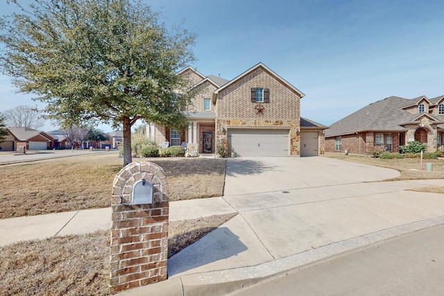 view of front of home featuring brick siding, driveway, and an attached garage