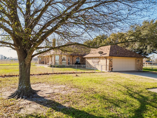 view of front of house with a front yard and a garage