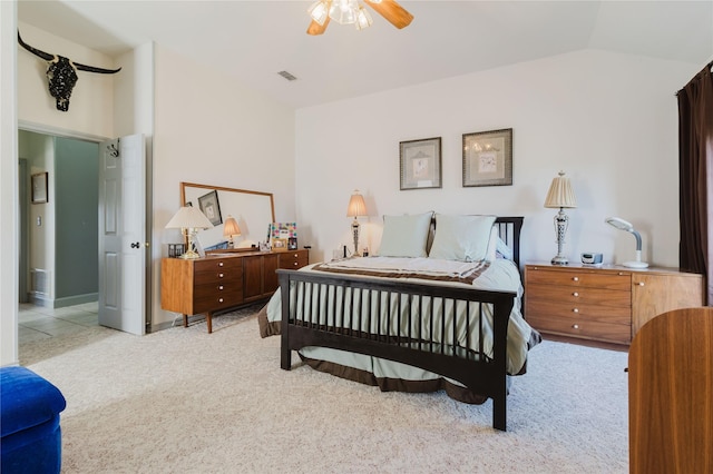 carpeted bedroom with ceiling fan and lofted ceiling