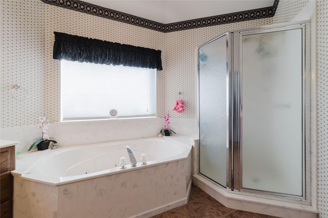 bathroom featuring shower with separate bathtub, tile patterned floors, and vanity